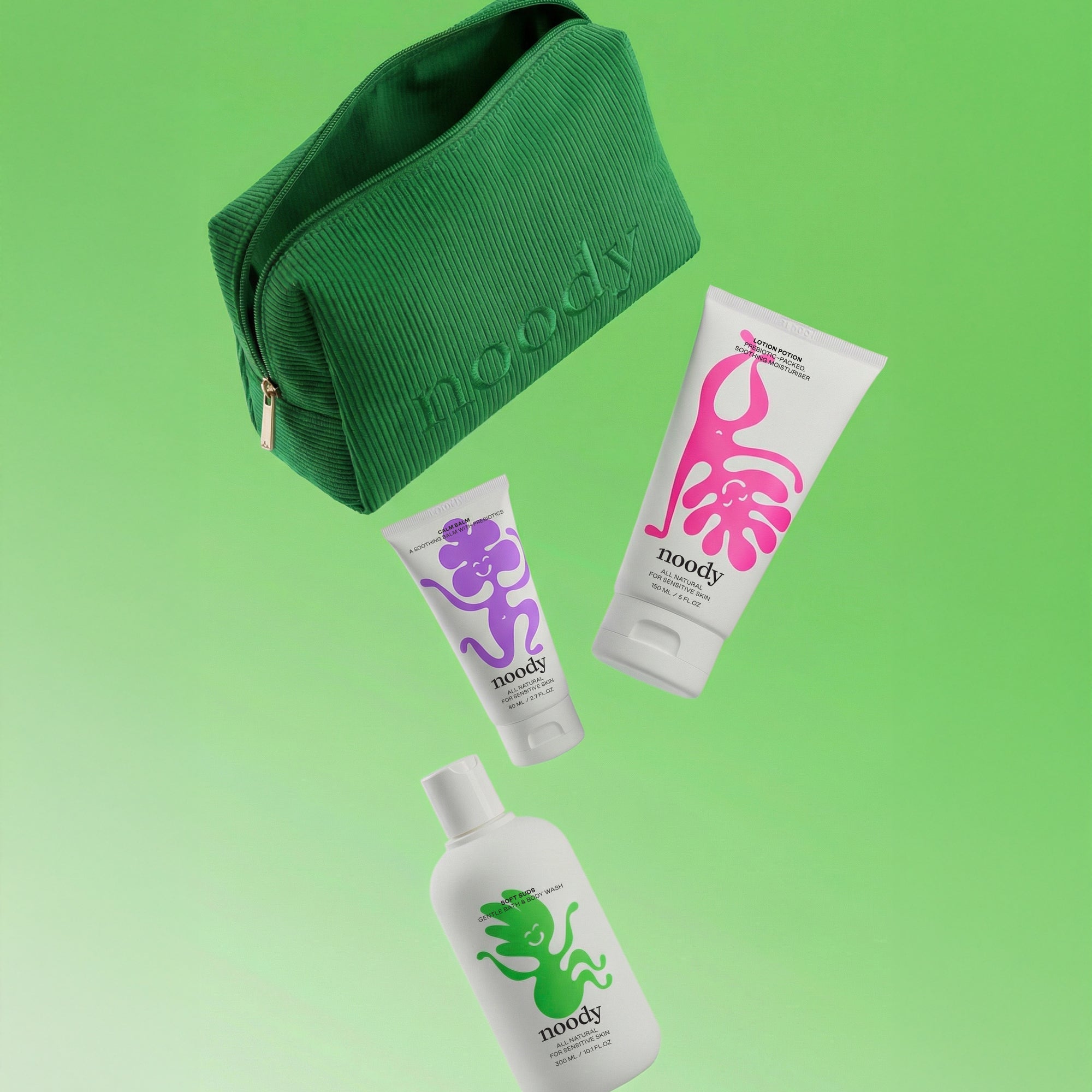Noody Happy Skin Set — three products (Soft Suds, Lotion Potion, Calm Balm) in a green corduroy travel bag. Made in Aotearoa.