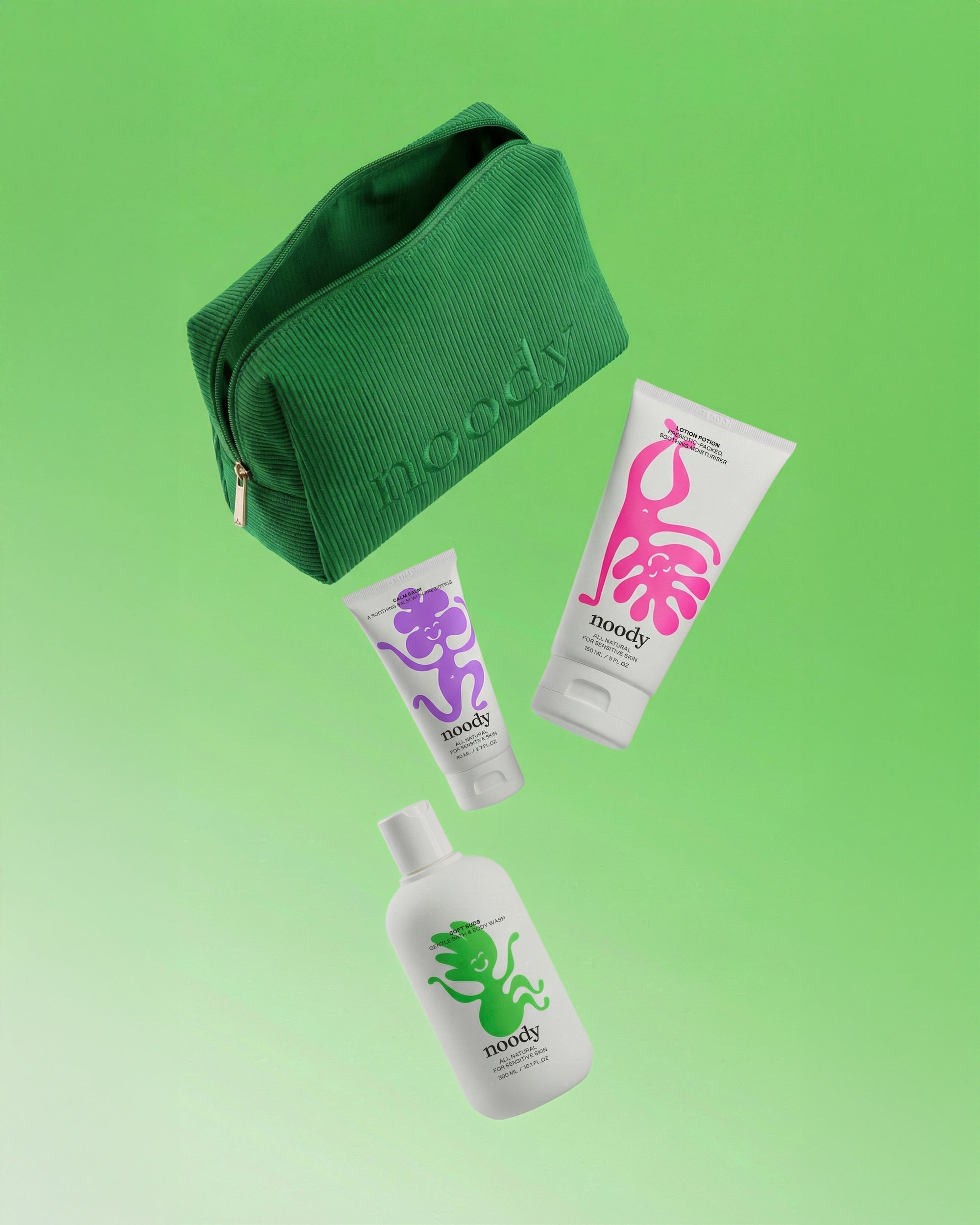 Noody Happy Skin Set — three products (Soft Suds, Lotion Potion, Calm Balm) in a green corduroy travel bag. Made in Aotearoa.