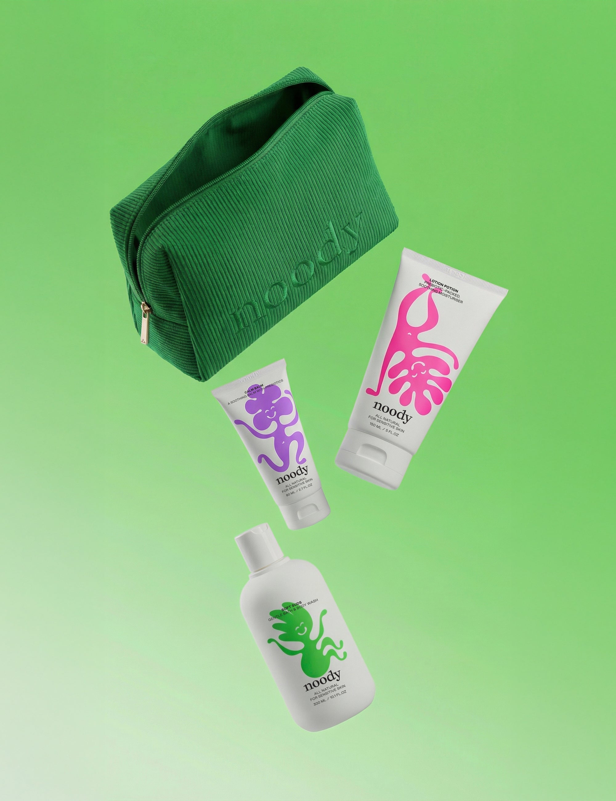Noody Happy Skin Set — three products (Soft Suds, Lotion Potion, Calm Balm) in a green corduroy travel bag. Made in Aotearoa.