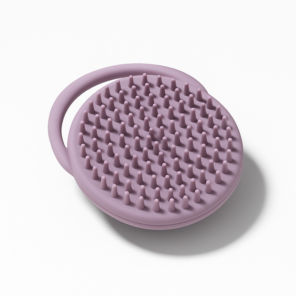 Noody silicone cradle cap brush in purple — food-grade silicone, soft nubs to lift scalp flakes without scratching baby's skin.