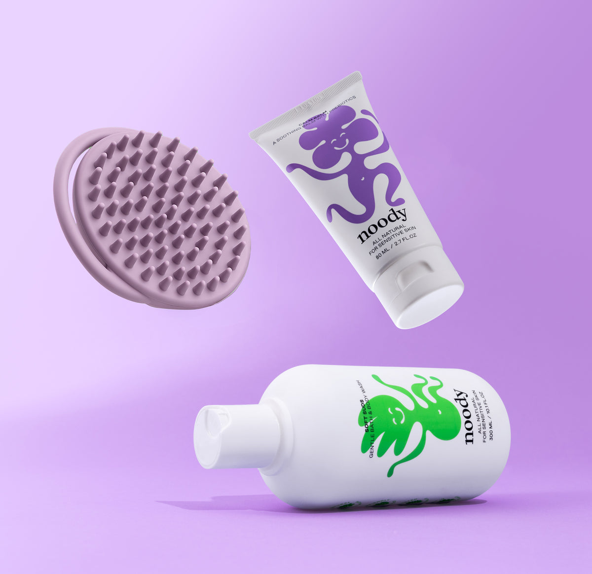Noody Cradle Cap Bundle — Soft Suds bath wash, food-grade silicone scalp brush, and Calm Balm for cradle cap flakes on babies and toddlers.